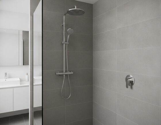 Thin-profile slimline shower head mounted flush against the wall